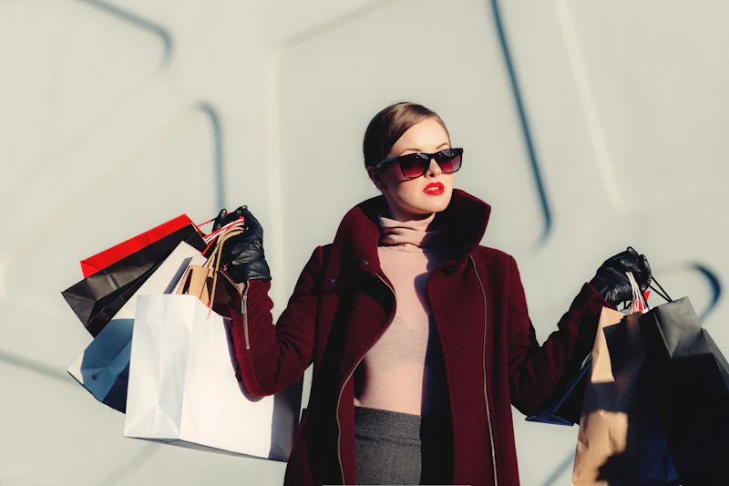 Shopper in a flowing dress carrying bags